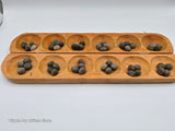 Ayo olopon( Hand carved wooden board game ) with seeds