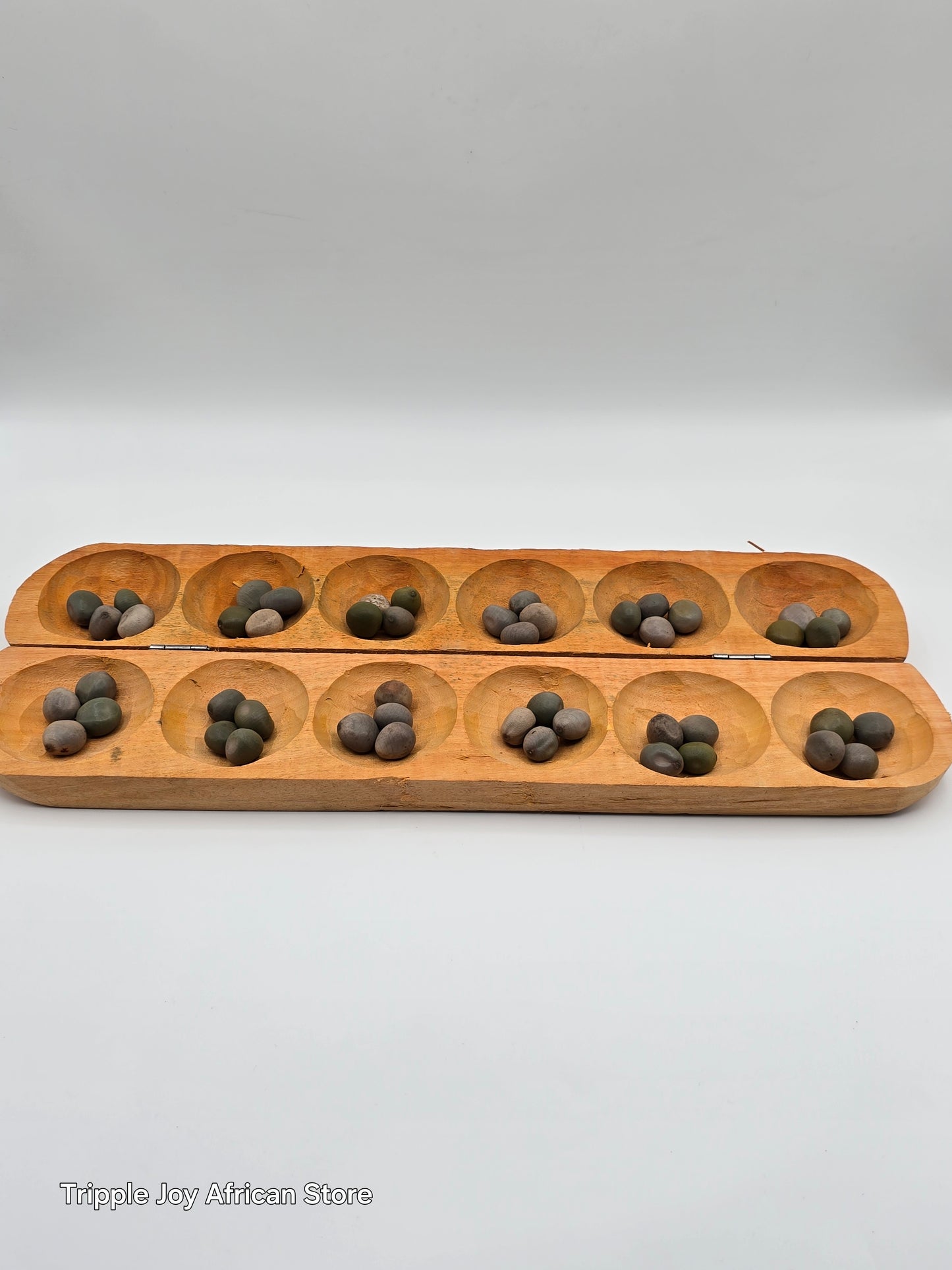 Ayo olopon wooden board game with seeds